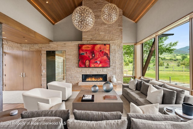 425 Aspen Valley Ranch Rd, Woody Creek, CO 81656 - view of patio / terrace with an outdoor living space with a fireplace and a mountain view