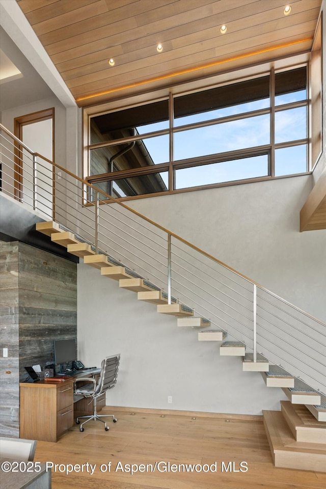 425 Aspen Valley Ranch Rd, Woody Creek, CO 81656 - stairs featuring wood finished floors, a towering ceiling, recessed lighting, and wooden ceiling