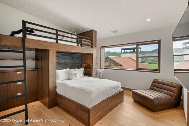 425 Aspen Valley Ranch Rd, Woody Creek, CO 81656 - bedroom featuring wood finished floors, lofted ceiling, and recessed lighting