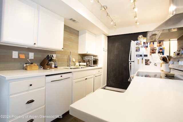 kitchen featuring tasteful backsplash, white appliances, ventilation hood, sink, and white cabinetry