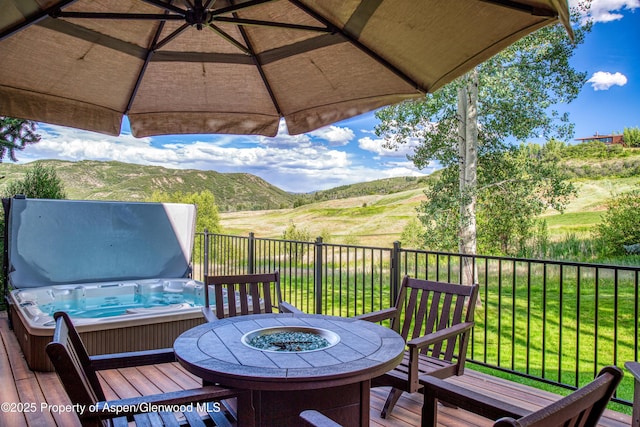 52 Harleston Grn Unit 38, Snowmass Village, CO 81615 - wooden deck with a hot tub and a mountain view