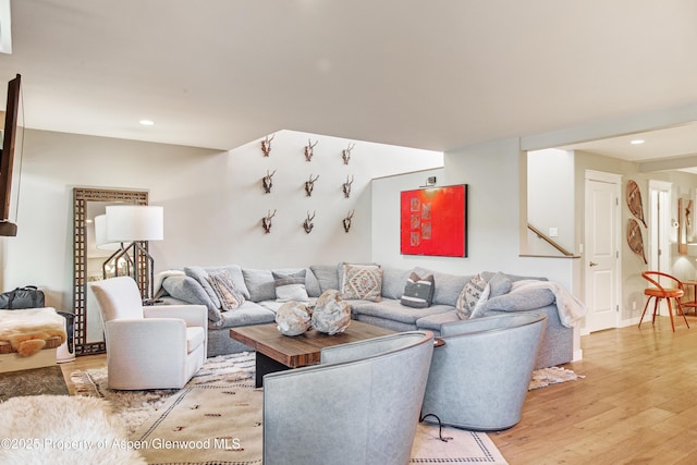 52 Harleston Grn Unit 38, Snowmass Village, CO 81615 - living room with light wood-type flooring, recessed lighting, and stairway