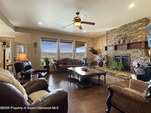 living area featuring a ceiling fan, wood finished floors, recessed lighting, and a fireplace