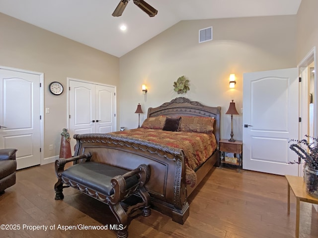 bedroom featuring wood-type flooring, high vaulted ceiling, and ceiling fan