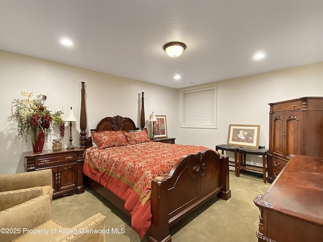 bedroom featuring light colored carpet and recessed lighting