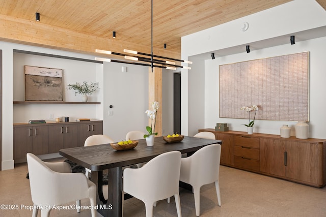 dining area featuring wood ceiling