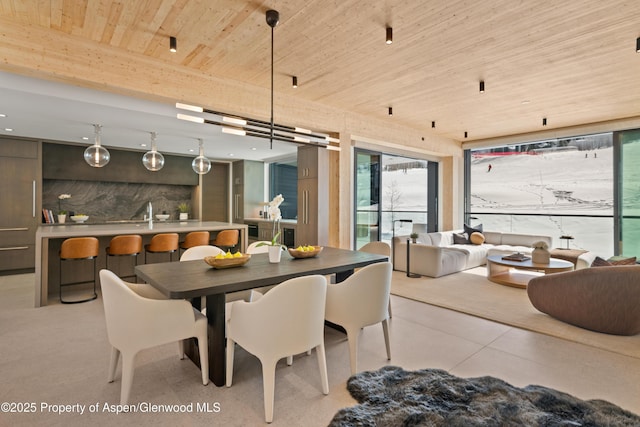 dining space featuring wooden ceiling