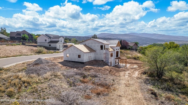 view of home's exterior with a mountain view