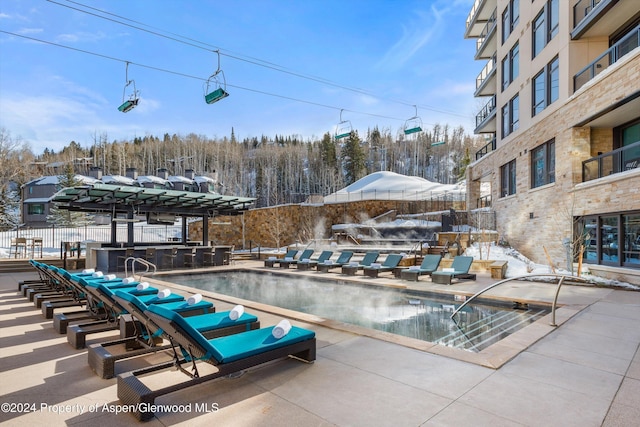 view of snow covered pool