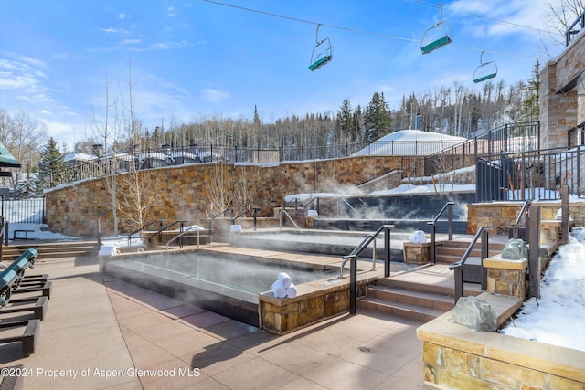 view of snow covered pool