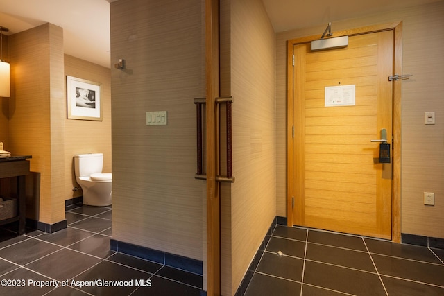 interior space featuring dark tile patterned floors