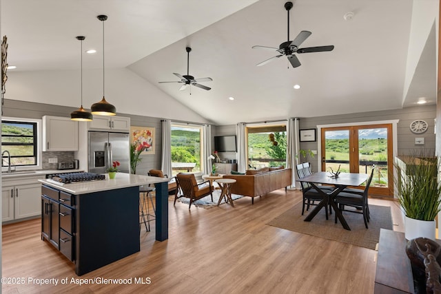 248 Basalt Mountain Dr, Carbondale, CO 81623 - kitchen with stainless steel appliances, light countertops, a kitchen island, white cabinets, and ceiling fan