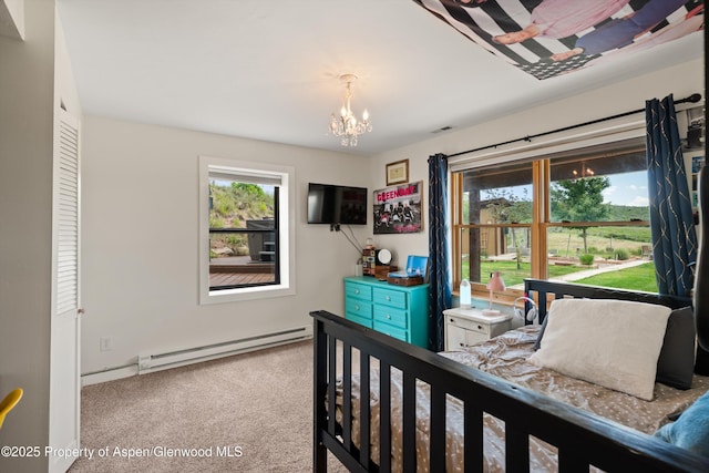248 Basalt Mountain Dr, Carbondale, CO 81623 - carpeted bedroom with a baseboard radiator and a chandelier