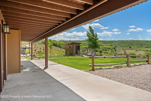 248 Basalt Mountain Dr, Carbondale, CO 81623 - view of patio / terrace with a storage shed and a wooded view