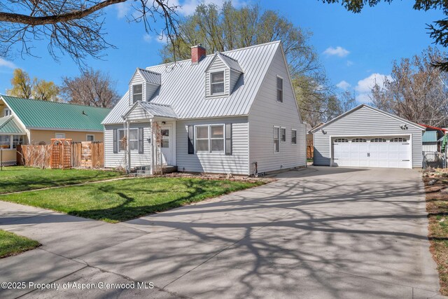 668 Taylor St, Craig, CO 81625 - cape cod house featuring a chimney, metal roof, fence, a front yard, and an outbuilding