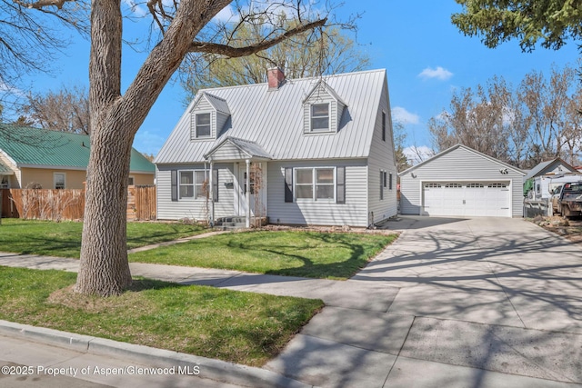 668 Taylor St, Craig, CO 81625 - new england style home featuring a chimney, metal roof, an outbuilding, and fence