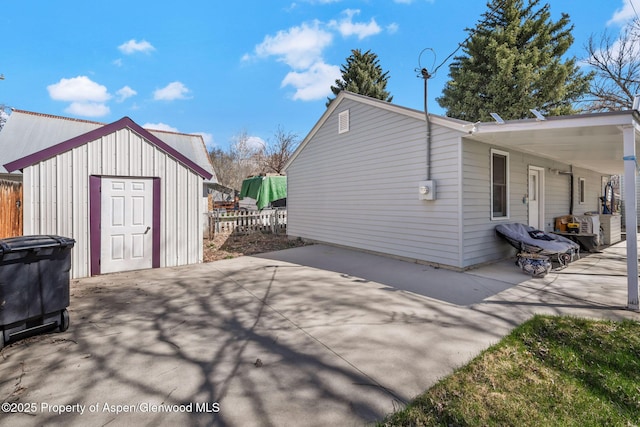 668 Taylor St, Craig, CO 81625 - exterior space featuring a patio area, fence, a storage shed, and an outdoor structure