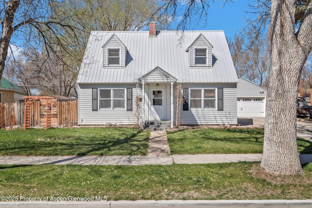 668 Taylor St, Craig, CO 81625 - cape cod-style house with fence, an attached garage, a front yard, entry steps, and a chimney