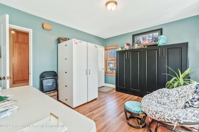 668 Taylor St, Craig, CO 81625 - bedroom with light wood-style flooring and baseboards
