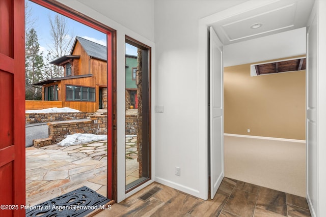 doorway featuring visible vents and baseboards