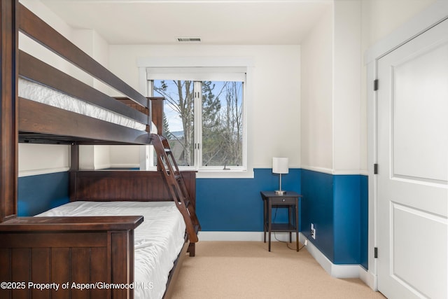 bedroom with carpet floors and baseboards