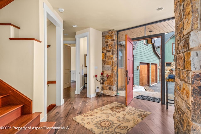 entrance foyer with hardwood / wood-style flooring and stairway