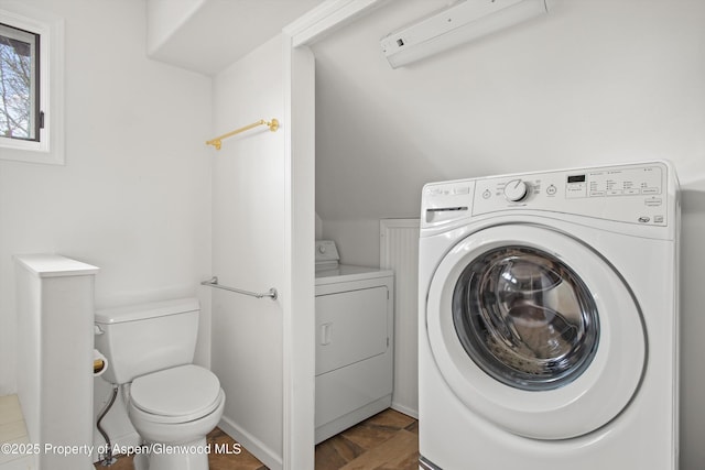 clothes washing area with washer and dryer and laundry area