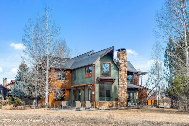 view of front of home with a chimney