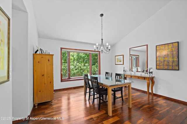 309 Deer Run, Carbondale, CO 81623 - dining area with vaulted ceiling, a chandelier, and dark wood-type flooring