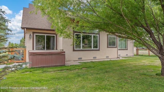 83 Native Springs Dr, Rifle, CO 81650 - view of property exterior featuring a hot tub, crawl space, a shingled roof, and stucco siding