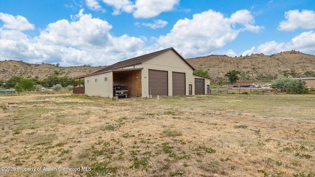 83 Native Springs Dr, Rifle, CO 81650 - garage featuring a mountain view and a garage