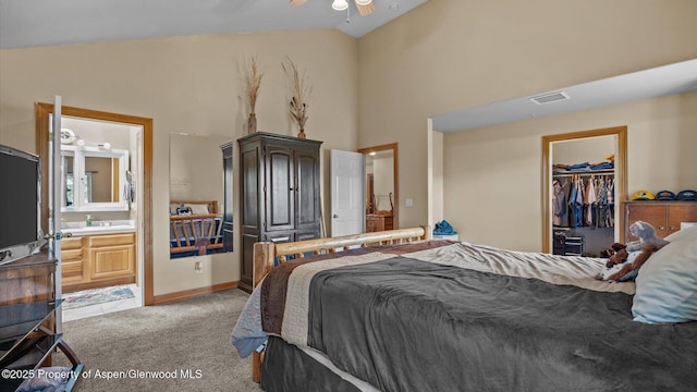 83 Native Springs Dr, Rifle, CO 81650 - bedroom featuring light carpet, a spacious closet, connected bathroom, high vaulted ceiling, and a closet