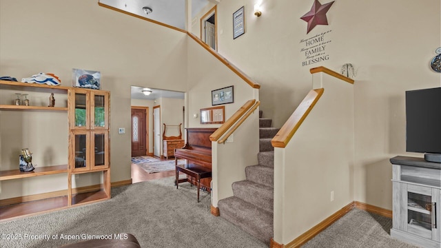 83 Native Springs Dr, Rifle, CO 81650 - stairway with carpet floors and a towering ceiling