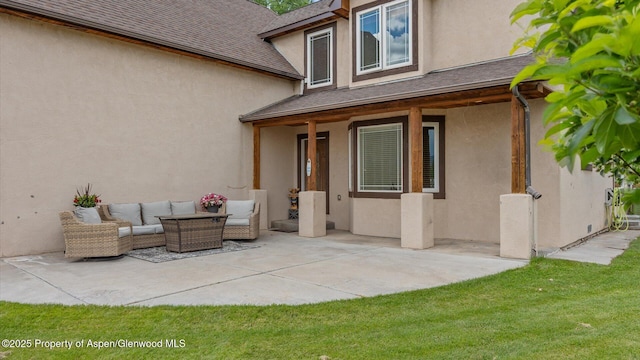 83 Native Springs Dr, Rifle, CO 81650 - property entrance featuring a patio area, stucco siding, and outdoor lounge area