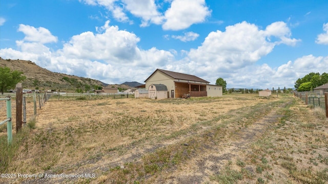 83 Native Springs Dr, Rifle, CO 81650 - view of yard with an outbuilding, a view of countryside, and a mountain view