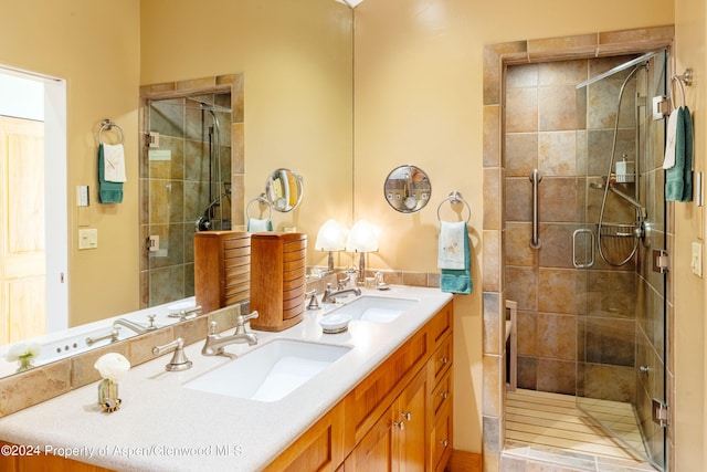 bathroom with vanity and an enclosed shower