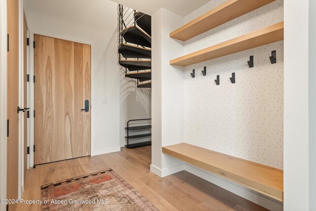 mudroom with light hardwood / wood-style floors