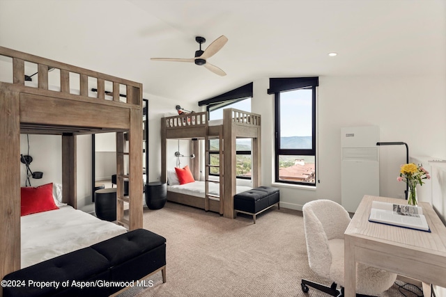 carpeted bedroom featuring ceiling fan and lofted ceiling