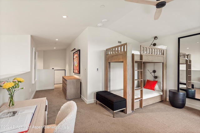 carpeted bedroom with vaulted ceiling