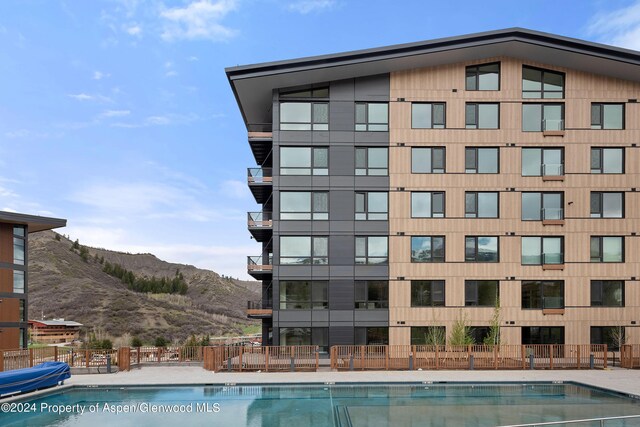 view of swimming pool featuring a mountain view