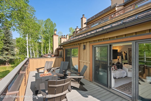 294 Snowmass Club Cir Unit 1207, Snowmass Village, CO 81615 - wooden terrace with an outdoor fire pit