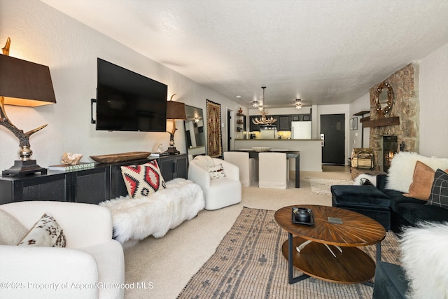 294 Snowmass Club Cir Unit 1207, Snowmass Village, CO 81615 - living room featuring a chandelier, light carpet, and a fireplace