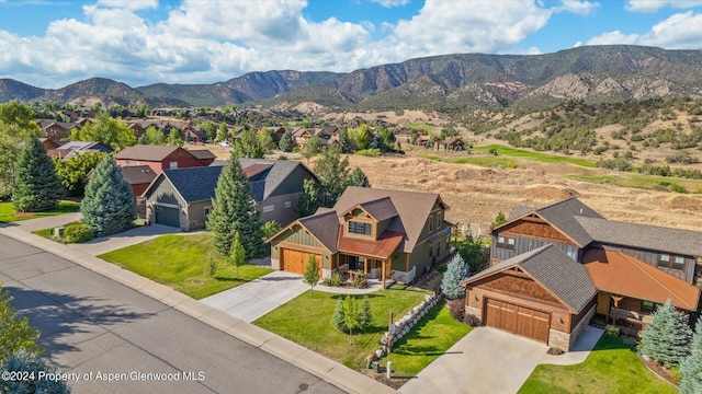 aerial view with a mountain view and a residential view