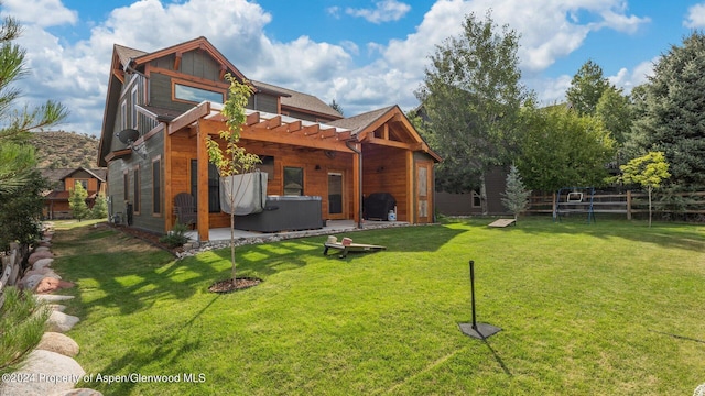 back of house with fence, a pergola, a hot tub, central air condition unit, and a lawn