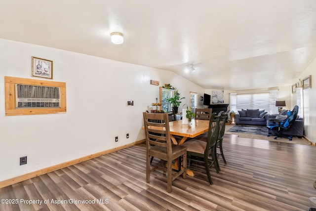 1618 Barclay St, Craig, CO 81625 - dining space featuring wood finished floors, baseboards, and an AC wall unit