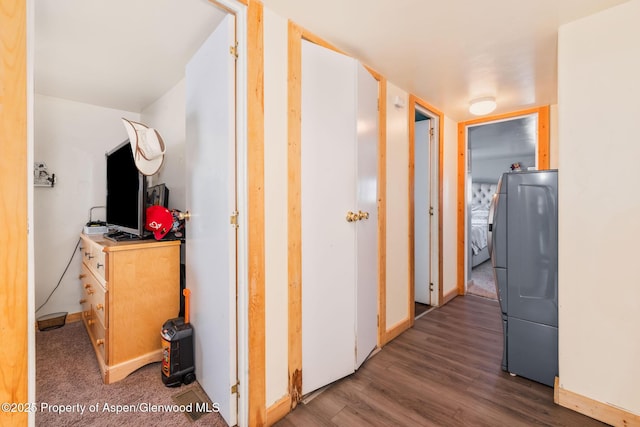 1618 Barclay St, Craig, CO 81625 - hallway featuring wood finished floors and separate washer and dryer