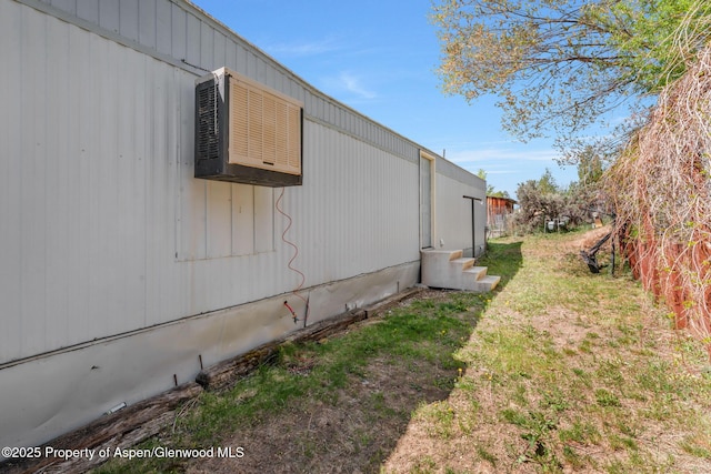 1618 Barclay St, Craig, CO 81625 - view of property exterior with entry steps and an AC wall unit