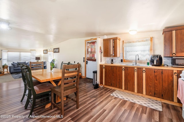 1618 Barclay St, Craig, CO 81625 - dining space featuring dark wood-style floors and vaulted ceiling