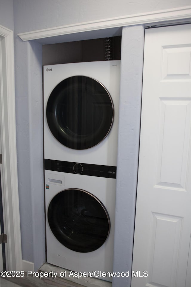 2701 Midland Ave Unit 412, Glenwood Springs, CO 81601 - washroom featuring stacked washer / drying machine