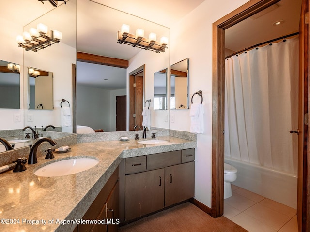 full bathroom with toilet, vanity, tile patterned floors, and shower / bath combo with shower curtain